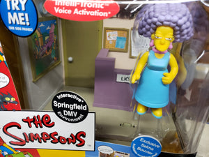 The Simpsons "DMV & Exclusive Selma Bouvier" WORLD OF SPRINGFIELD - Playset & Interactive Figure (Playmates)