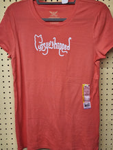 Load image into Gallery viewer, Front view of coral crewneck t-shirt hanging flat with size sticker