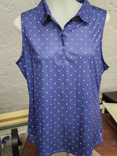Load image into Gallery viewer, Front view on mannequin of navy and white polka dot sleeveless polo top