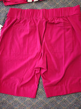 Load image into Gallery viewer, Back view of raspberry trouser shorts showing elastic waistband and back welt pockets